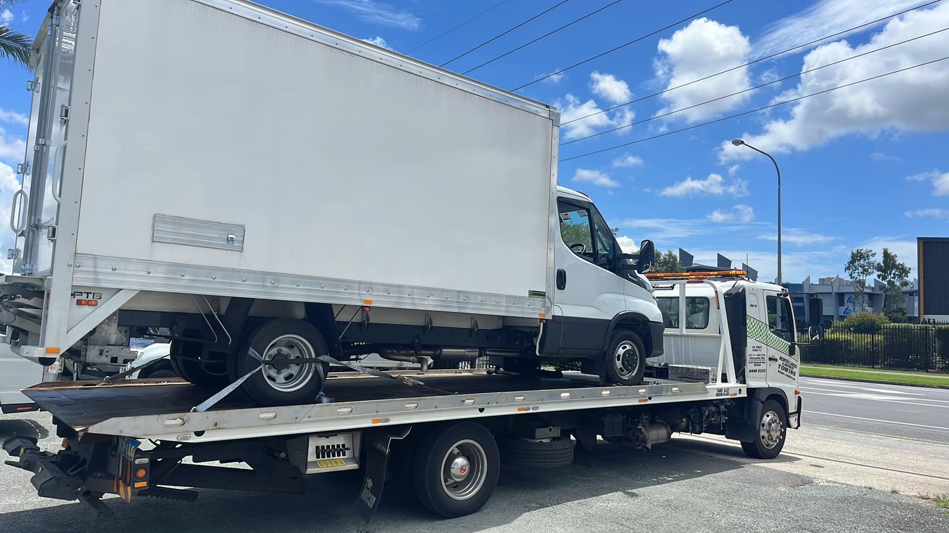 Tow Truck Carrying a White Box Truck — A B & Forge Towing In North Lakes, QLD
