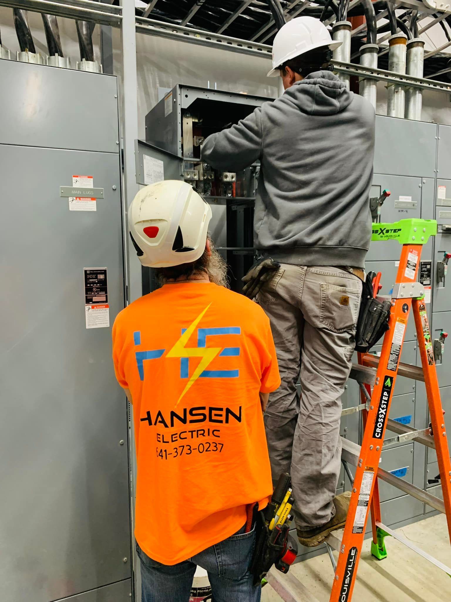 Electrician Working On Main Box — Alden, Iowa — Hansen Electrical Services