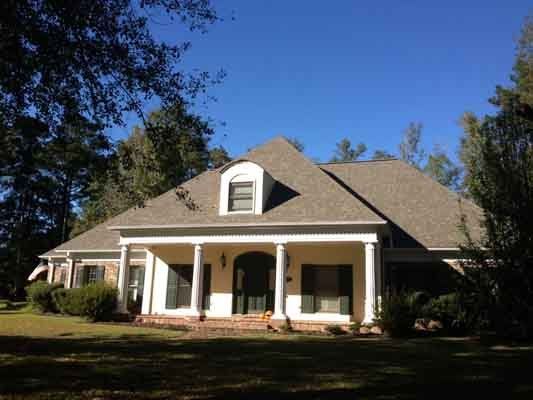 Roof Repair Contractor — House with Grey Color Roof  in Meridian, MS