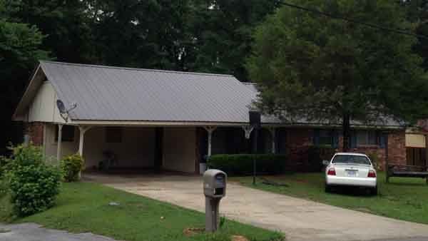 Roofing — House with White Car in Meridian, MS