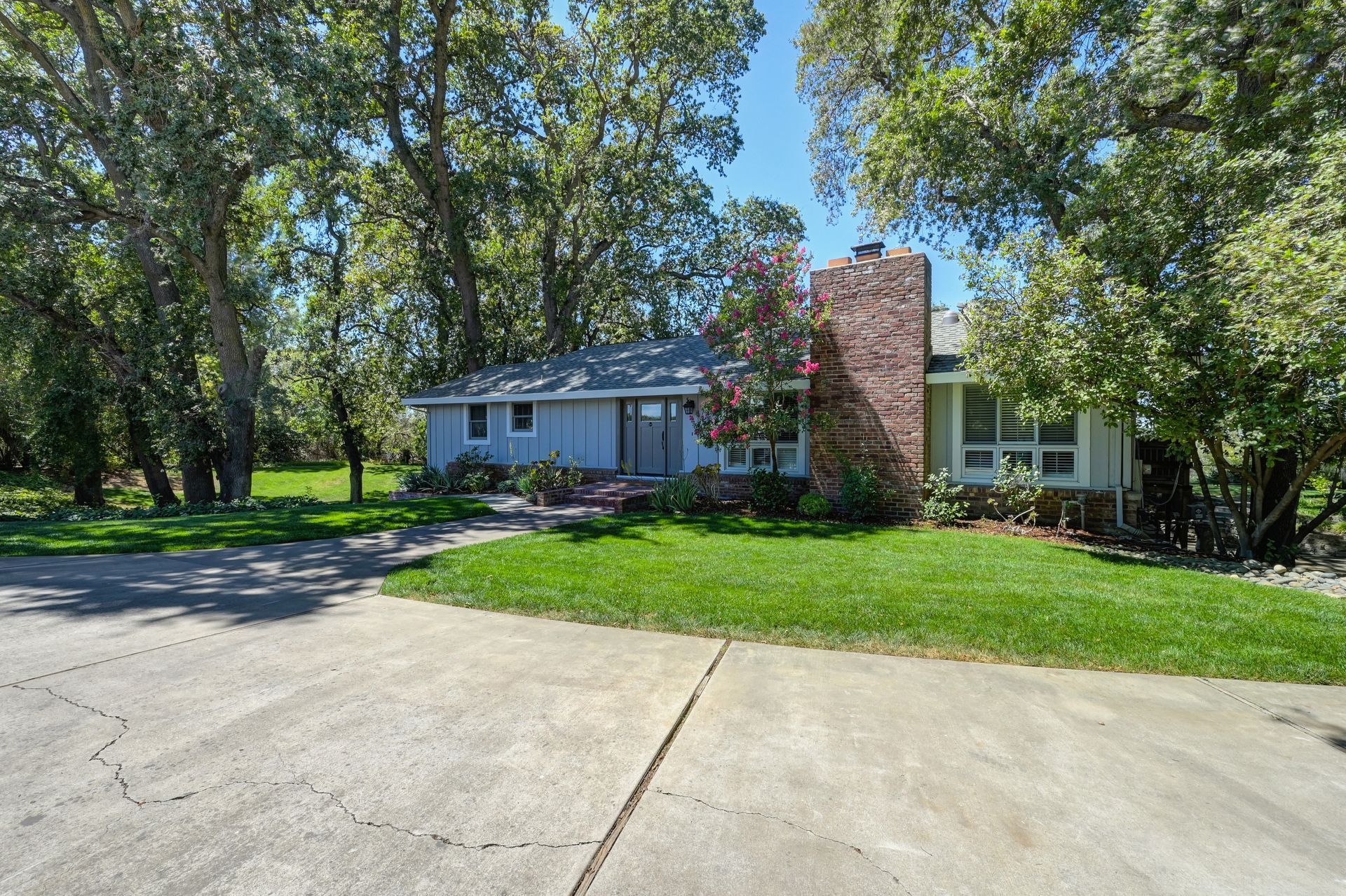7701 Garden Highway - White House with a Brick Chimney - Find East Sac’s best realtors with Rich Cazneaux Real Estate Group