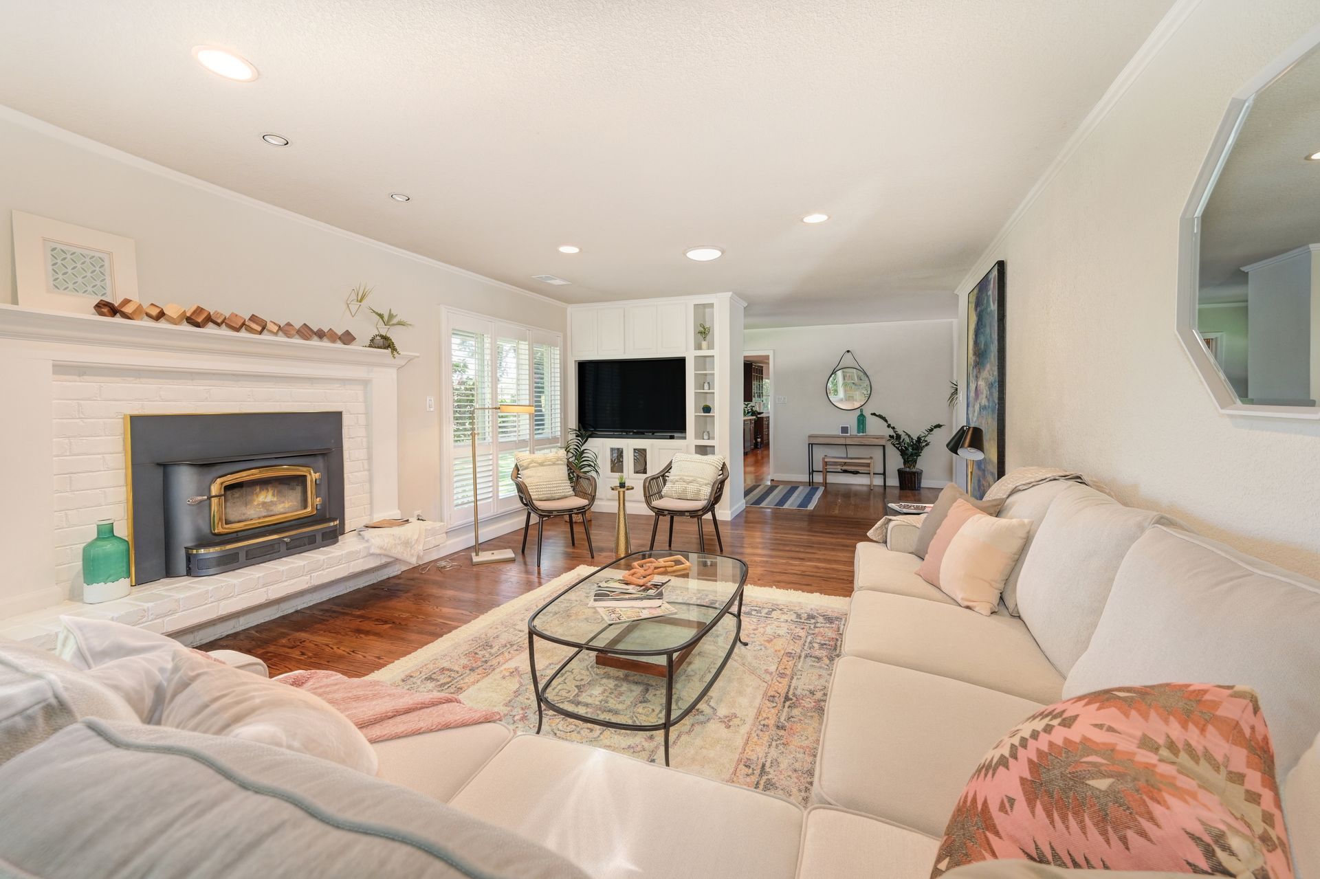 A living room with furniture and a fireplace. Search for Homes for Sale in East Sac with Rich Cazneaux Real Estate Group