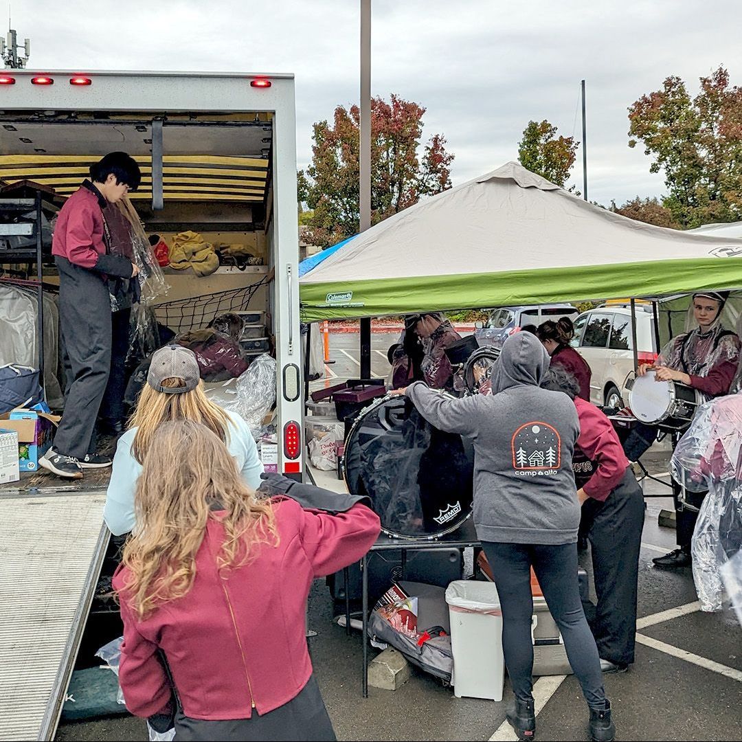 Group of people standing in front of a truck | Parade Truck Donation of Rich Cazneaux Real Estate Group in East Sac