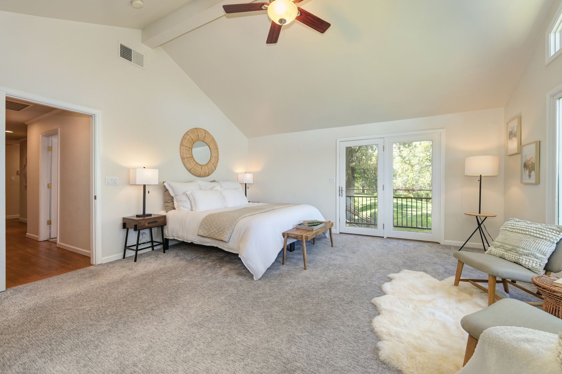 Large Bedroom with a ceiling fan and a large bed. Rich Cazneaux Real Estate Group: Discover the Best Realtors in East Sac