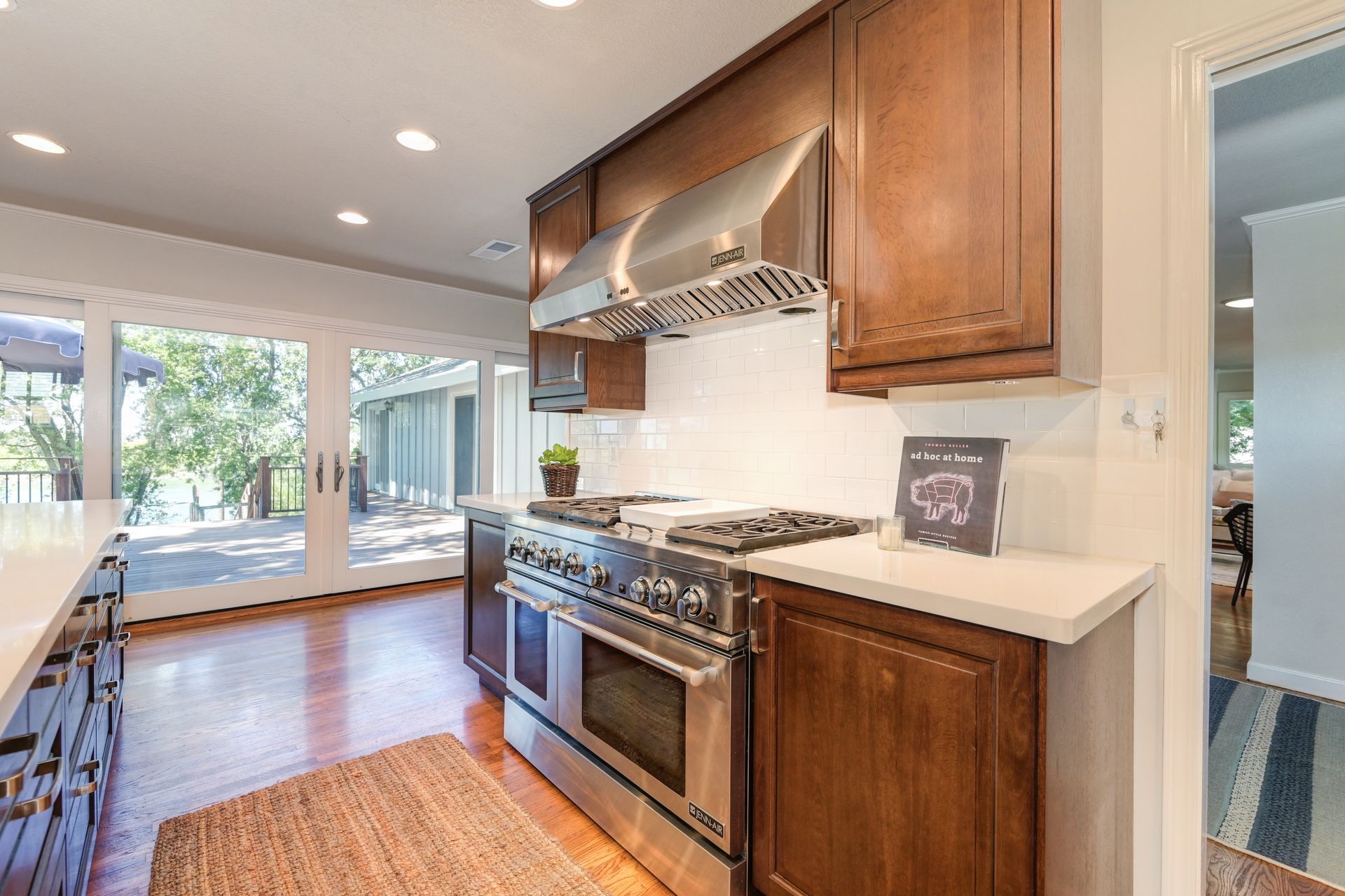 A kitchen with stainless steel appliances & wooden Cabinets. List your Home with the top Realtor in East Sac, Rich Cazneaux