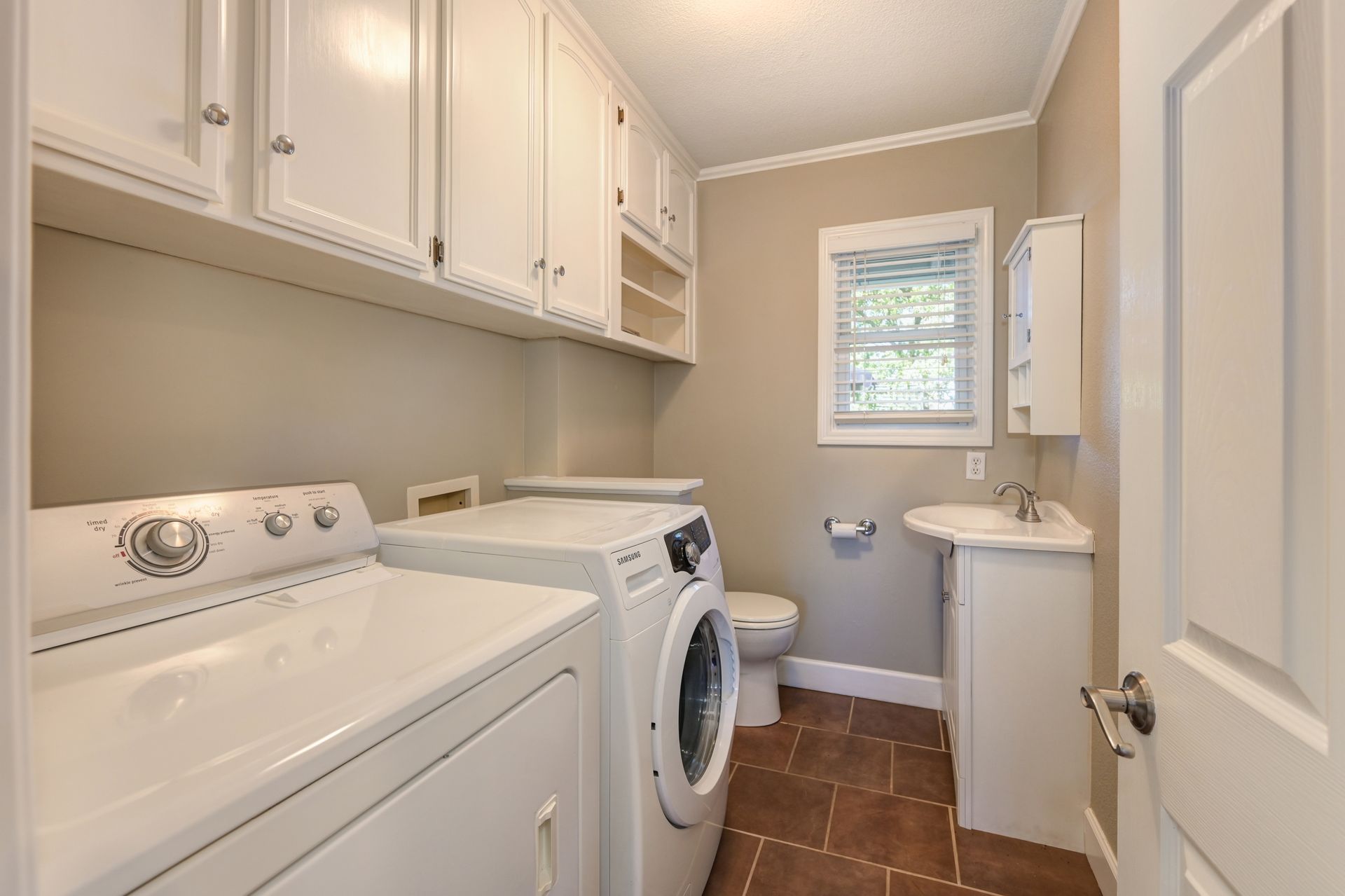 Laundry Room with a washer and dryer. Explore Homes for sale in East Sac with Rich Cazneaux Real Estate Group
