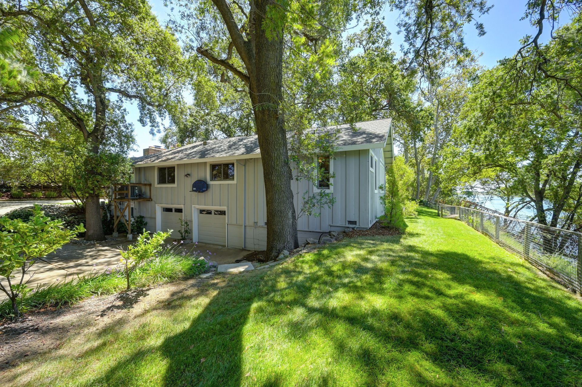 Bright home with river views and a shaded yard under large trees. Explore East Sacramento real estate with Rich Cazneaux.