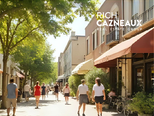 A group of people are walking down a city street.