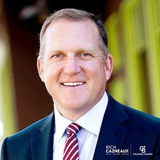 Rich Cazneaux, a realtor in East Sacramento, CA, with Coldwell Banker, smiling in a professional suit and tie.