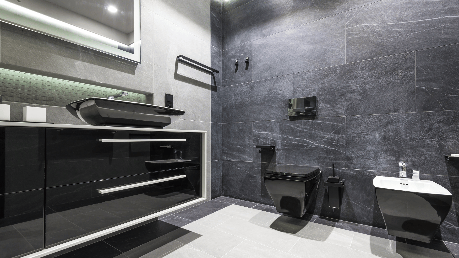 A bathroom with a sink , toilet , and mirror.