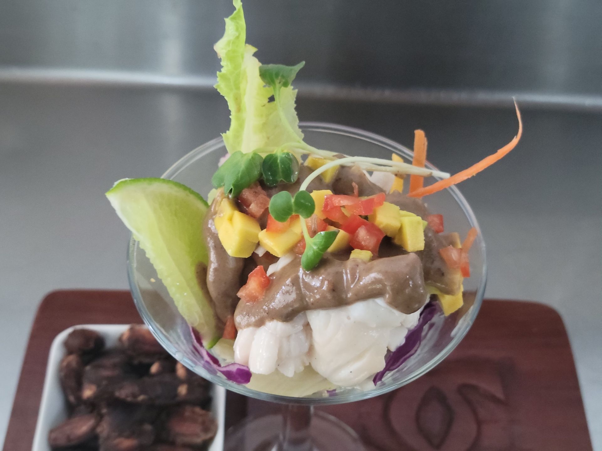 A cocktail glass with a Lobster, Avocado and Chocolate Appetiser in the Kitchen at Calabash Cove