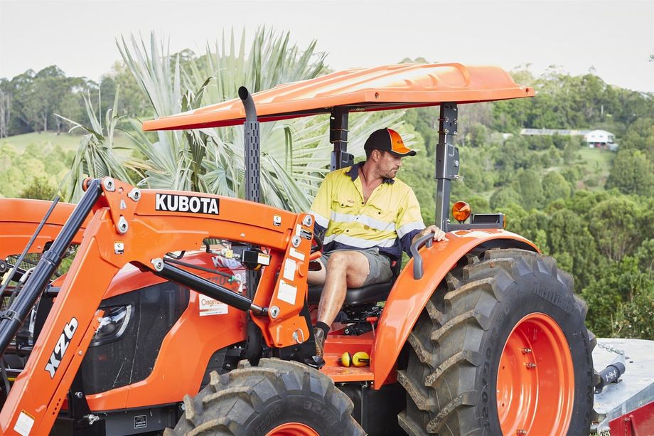 Worker Reversing Large Earthmoving Machine — Hinterland Property Services in Coopers Shoot, NSW