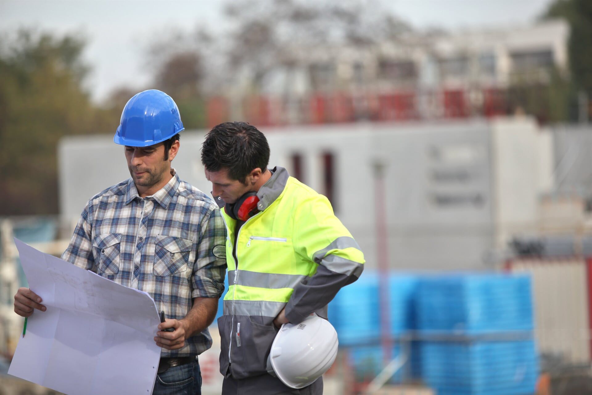 Workers Examining Construction Plans — Hinterland Property Services in Coopers Shoot, NSW
