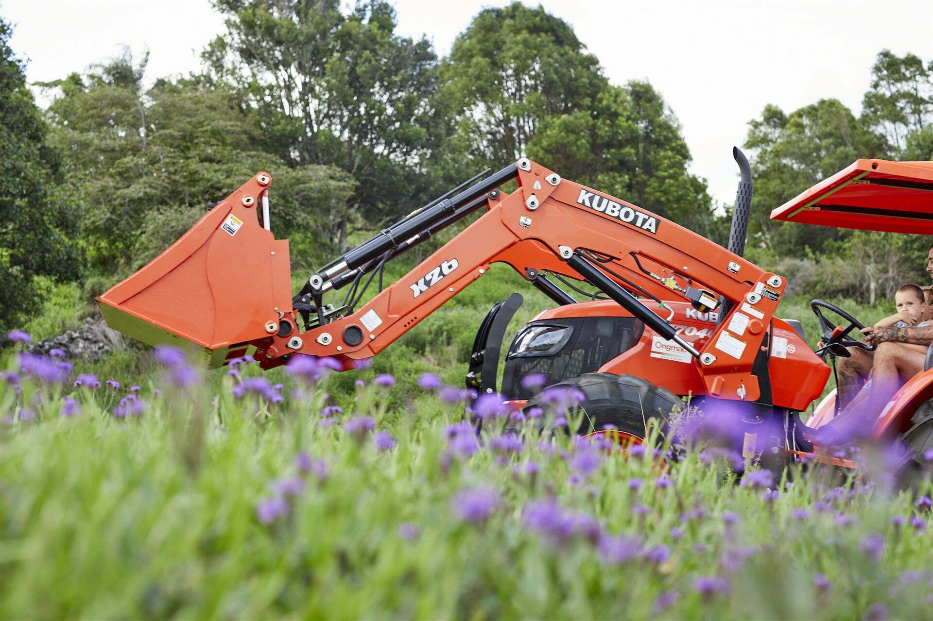 Orange Excavator in a Field — Hinterland Property Services in Coopers Shoot, NSW