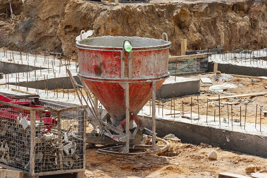 a cement mixer sitting on top of a construction site