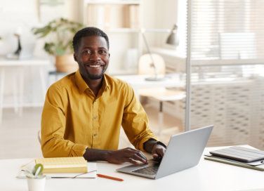 happy guy on laptop