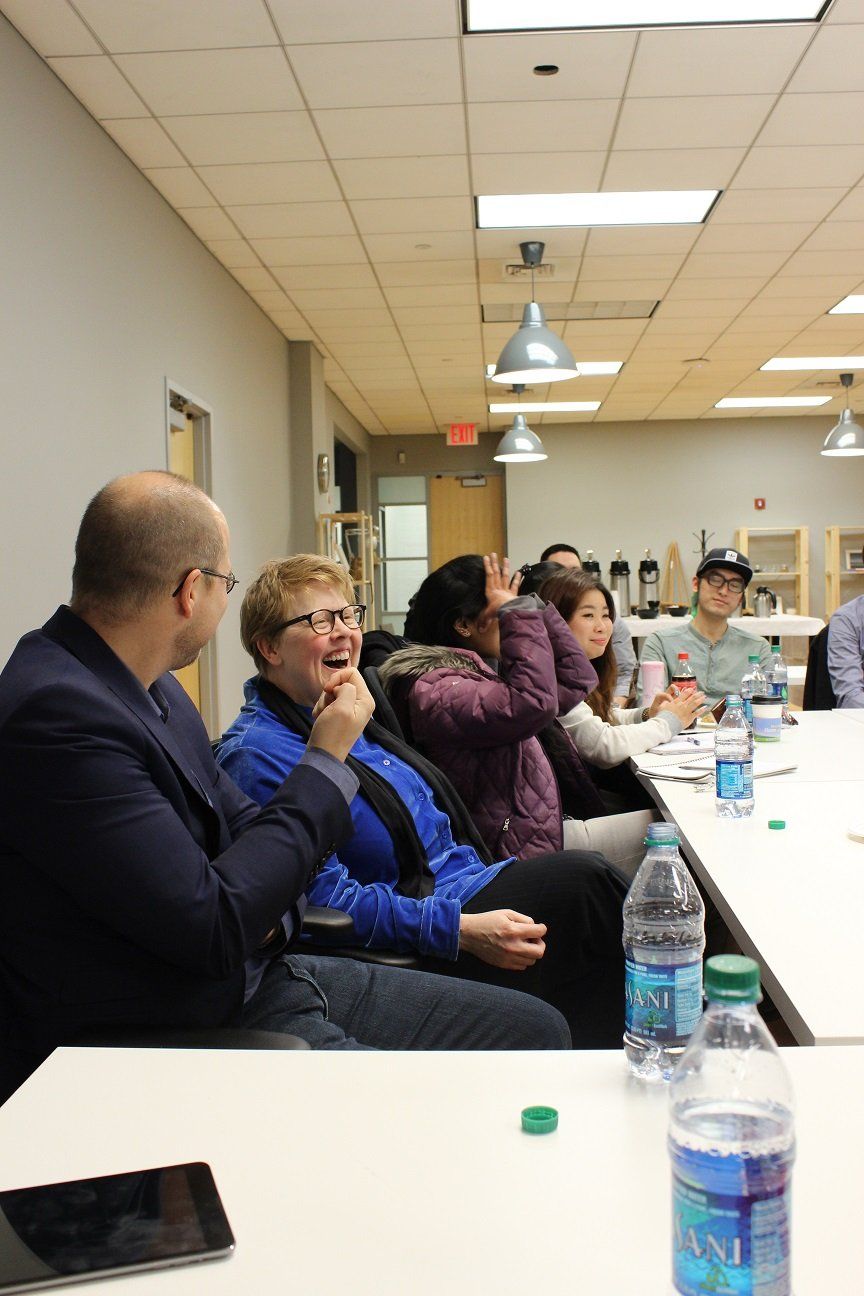 Picture of interactive lecture group at white meeting table