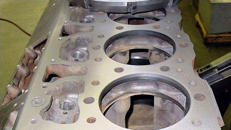 a close up of a metal block with holes in it