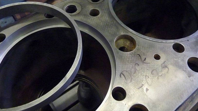 a close up of a metal cylinder with holes in it