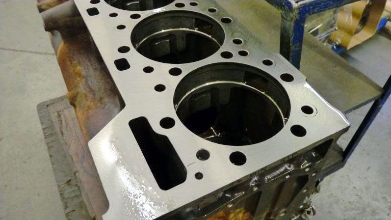 a close up of a cylinder block with holes in it