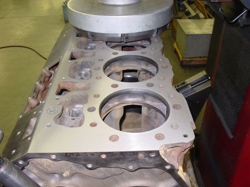 a close up of a cylinder block with holes in it
