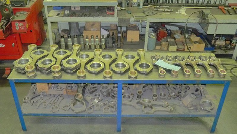 a table with a bunch of nuts and bolts on it