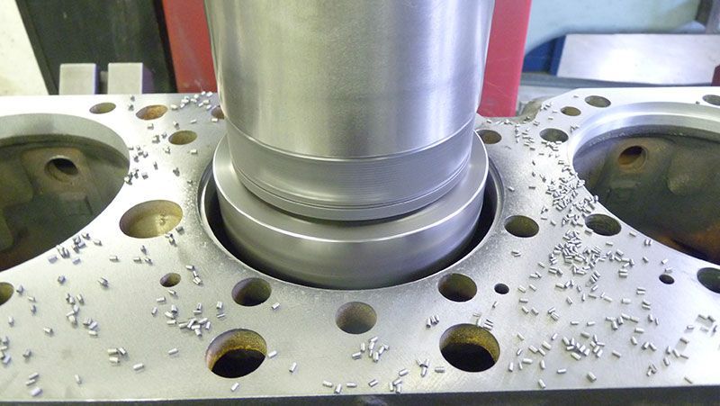 a close up of a metal cylinder with holes in it