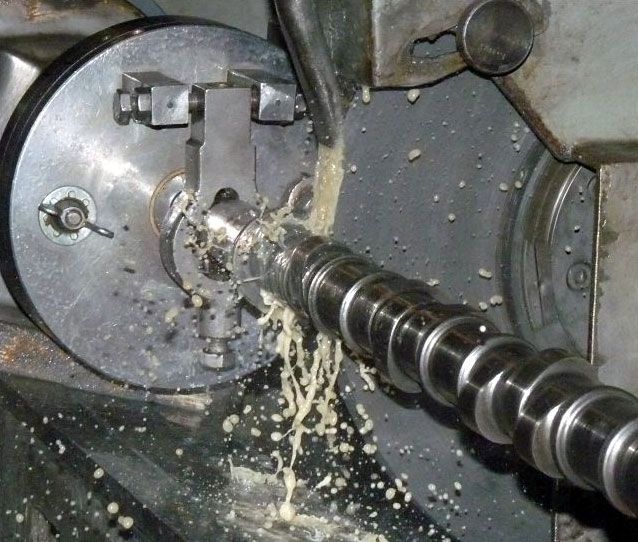 a close up of a machine cutting a piece of metal