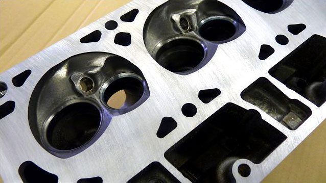 a close up of a piece of metal with holes in it