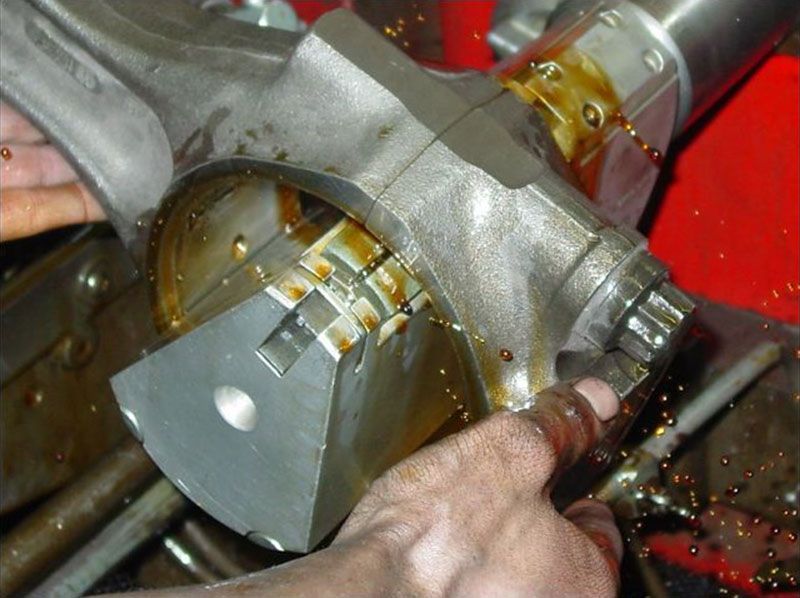 a close up of a person working on a piece of metal