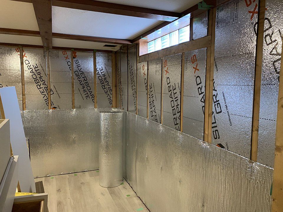 A room with a lot of insulation on the walls and a window.