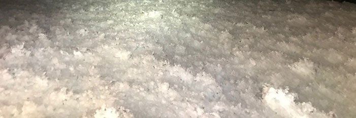 A bunch of white clouds are floating in the air.