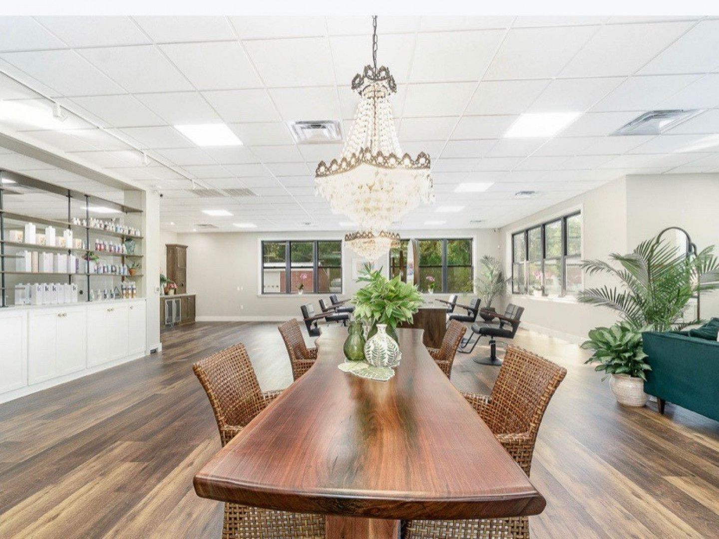 There is a long wooden table in the middle of the room.