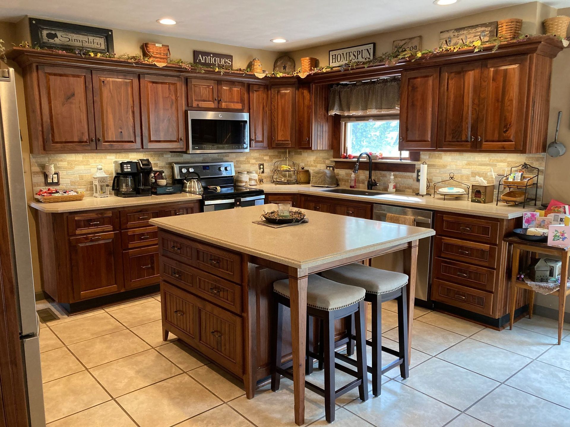 A kitchen with a large island in the middle of it.