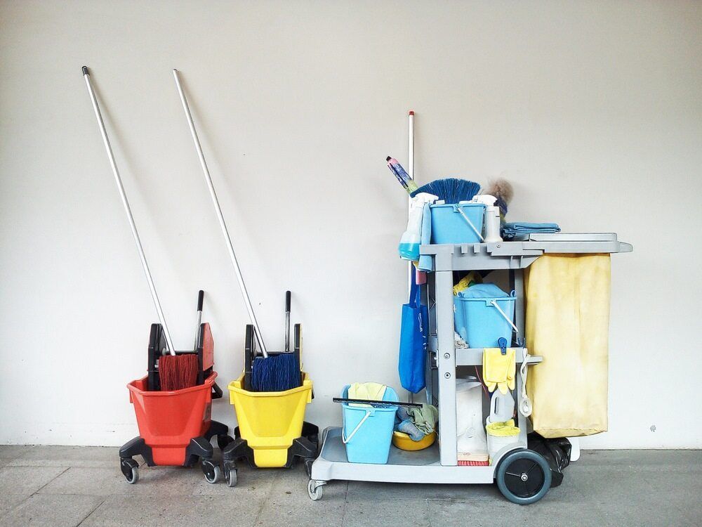 A Cleaning Cart With Buckets and Mops on It — Mackay Cleaning & Packaging Supplies in Mackay, QLD