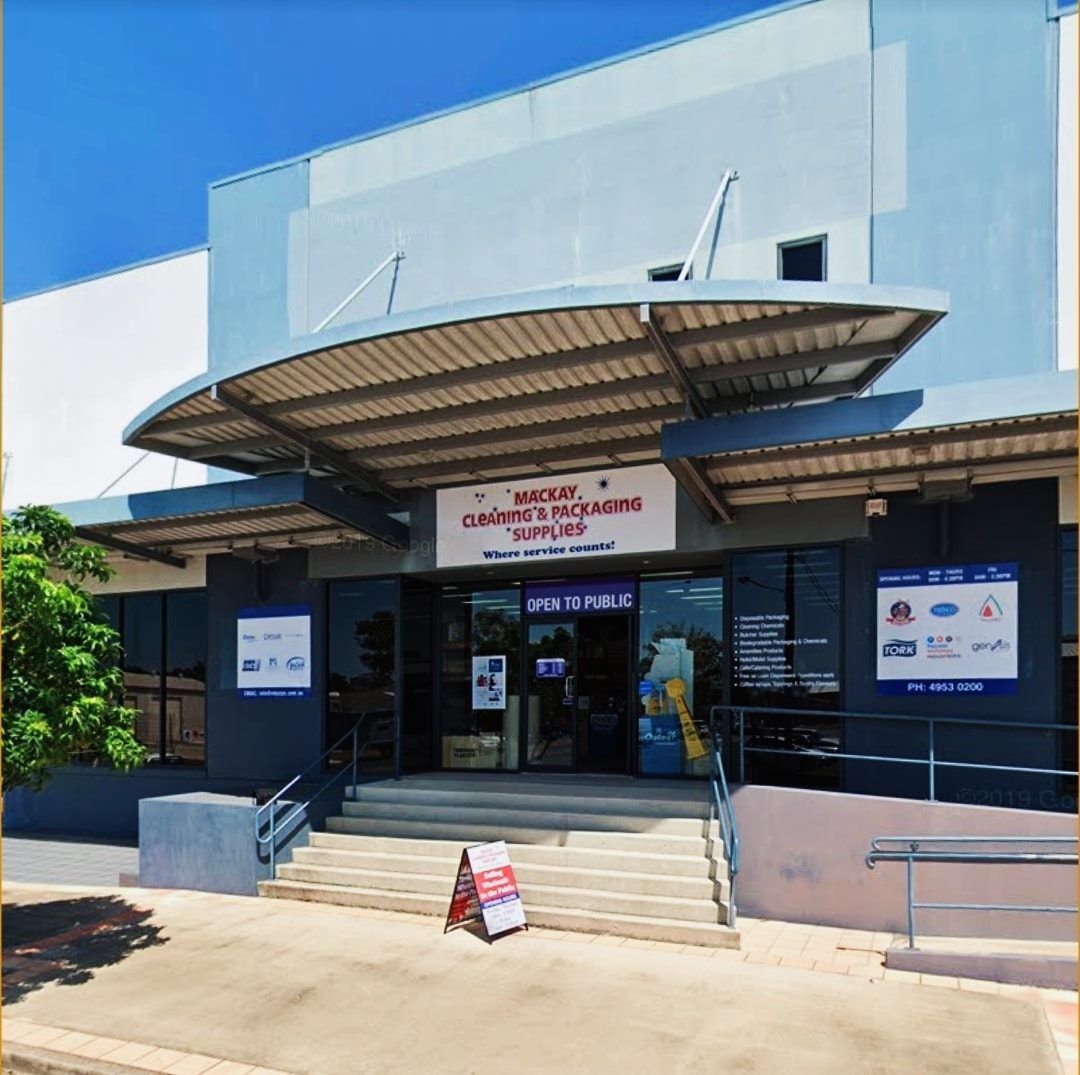 The front of a building with a sign that says work — Mackay Cleaning & Packaging Supplies in Mackay, QLD