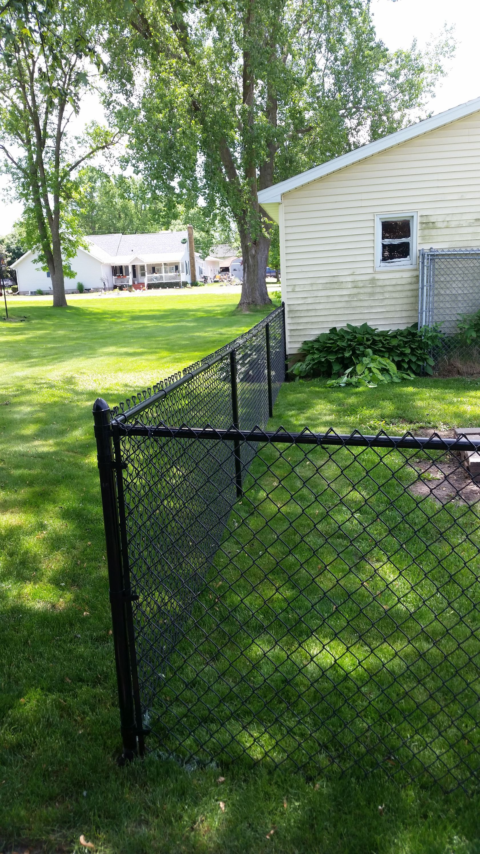 Black Chain On A House | Rochester, MN | The Fence Pro’s