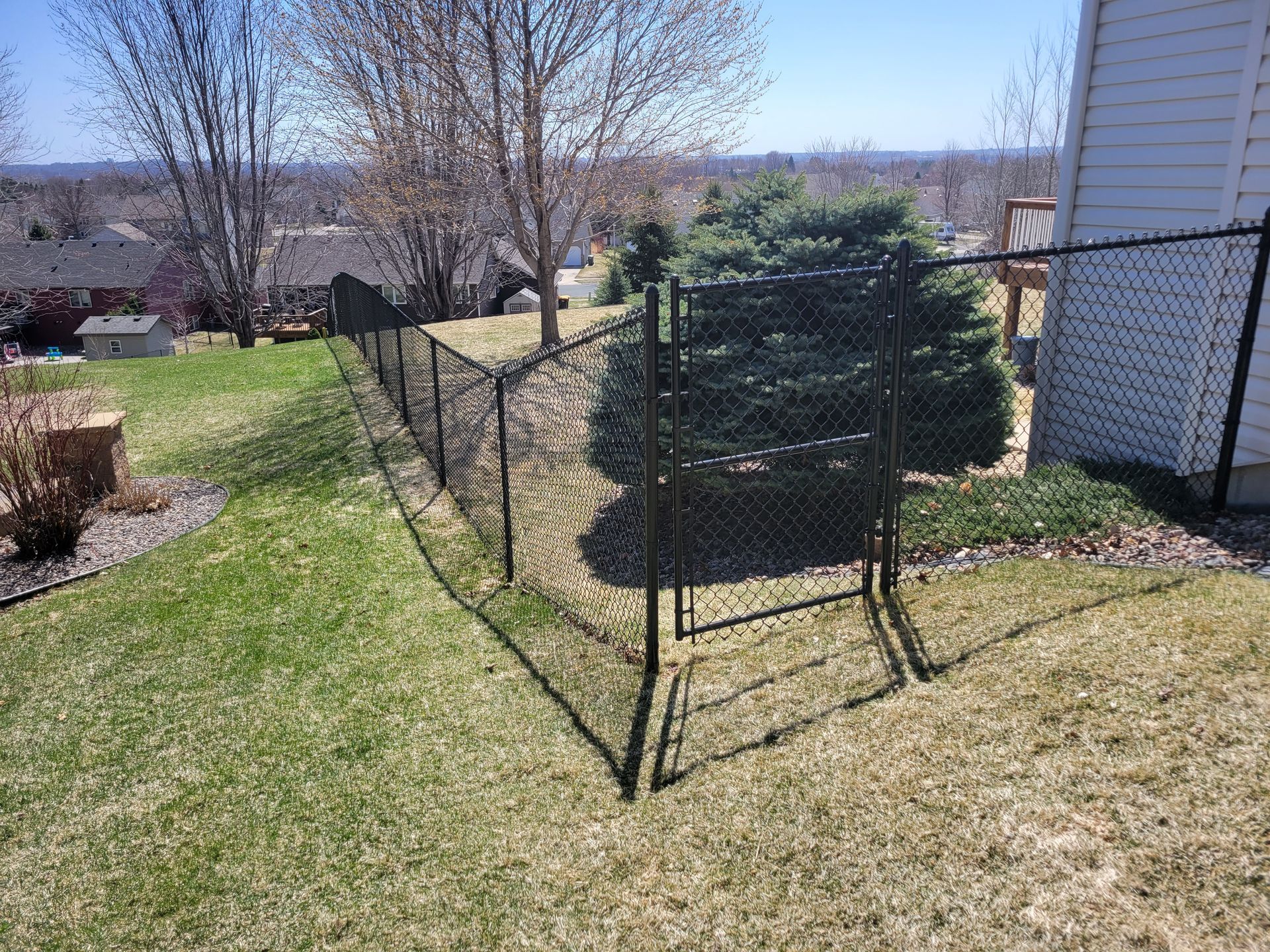 Chain Link Beside A Bush | Rochester, MN | The Fence Pro’s