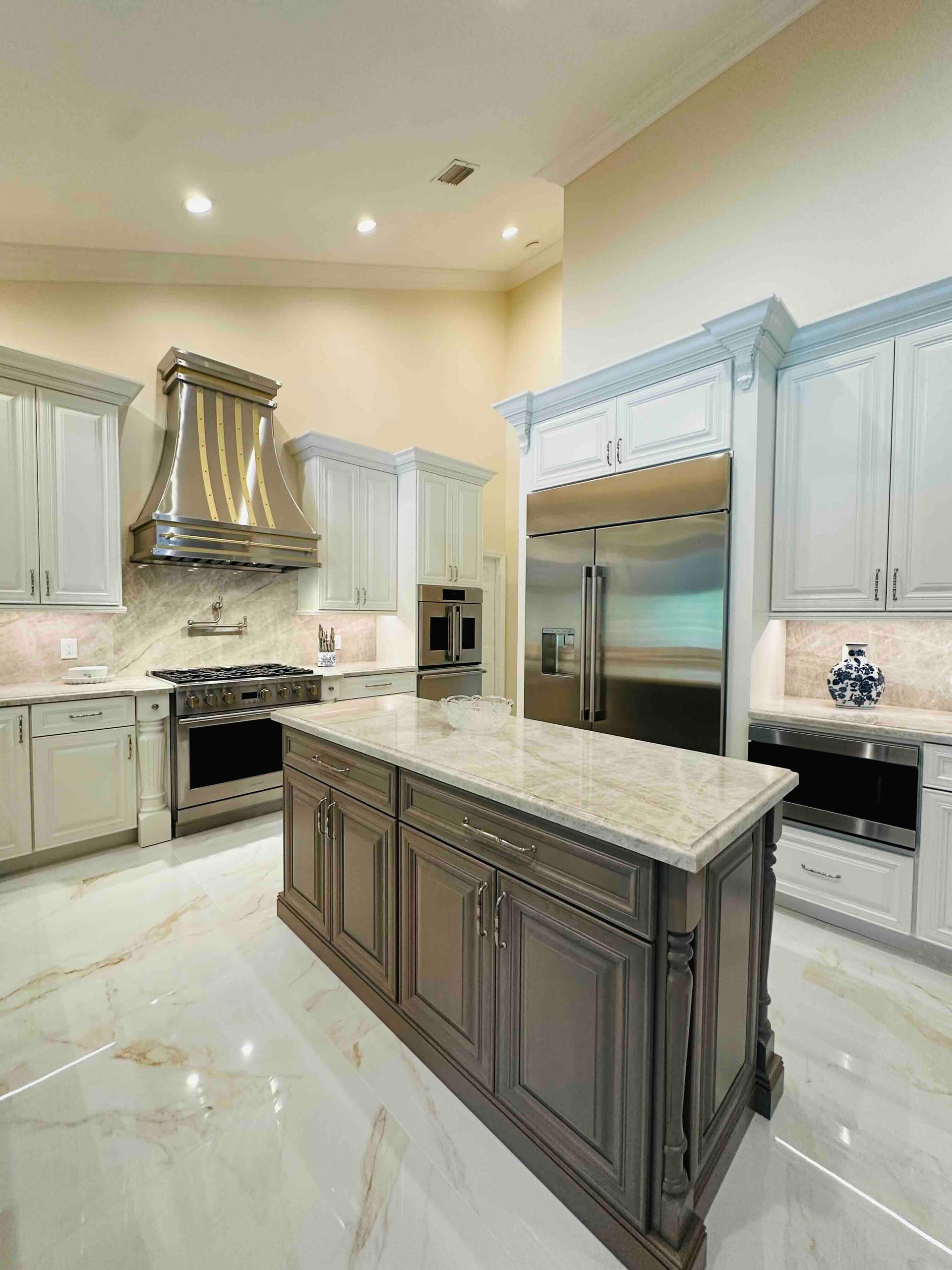 There is a large island in the middle of the kitchen.