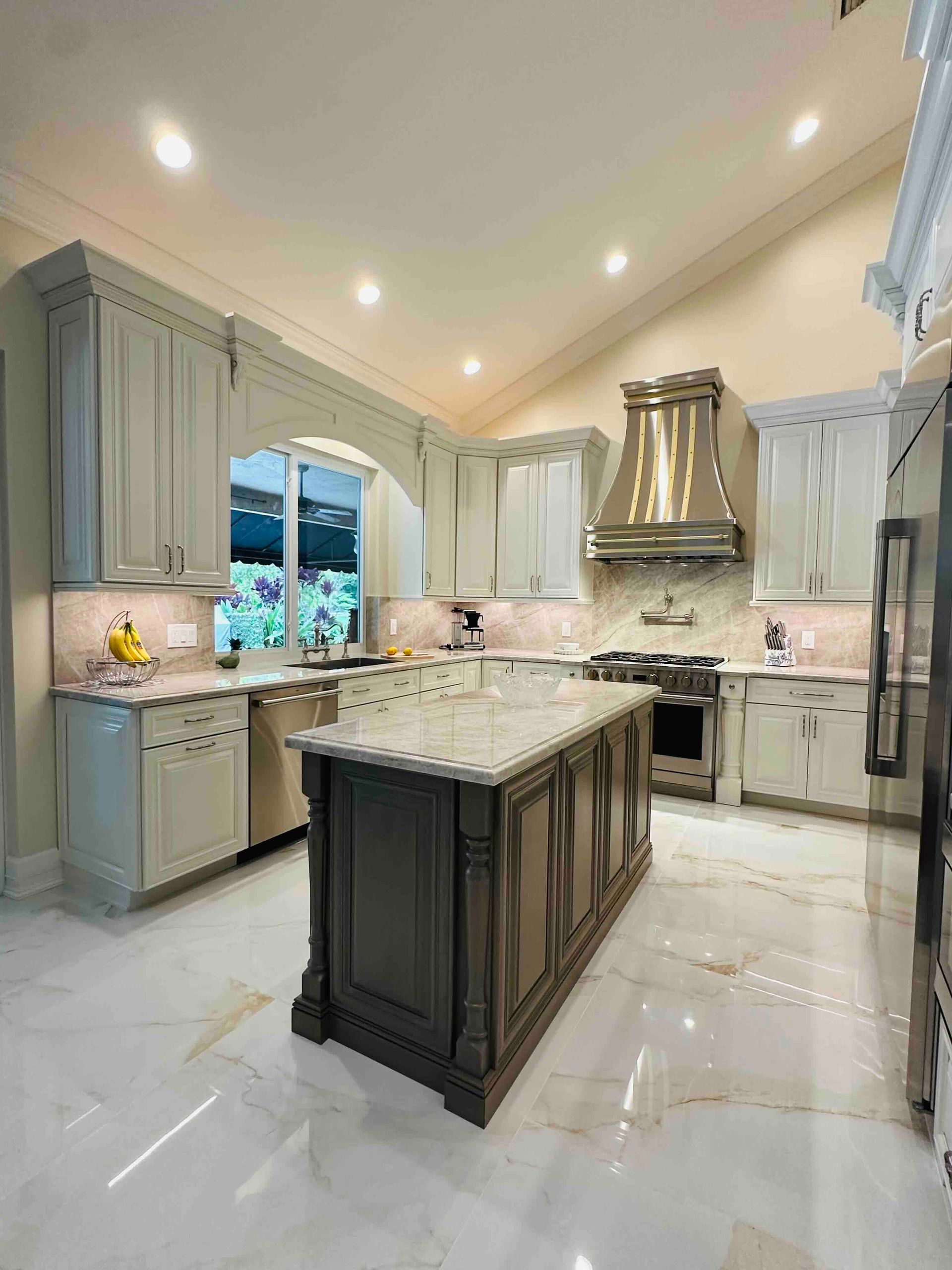 There is a large island in the middle of the kitchen.