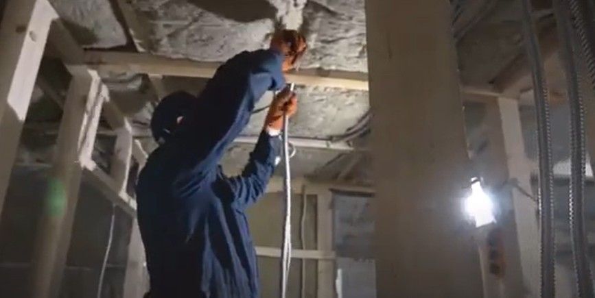 Commercial Electrician Performing Work