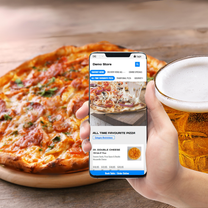 A person is holding a cell phone in front of a pizza.