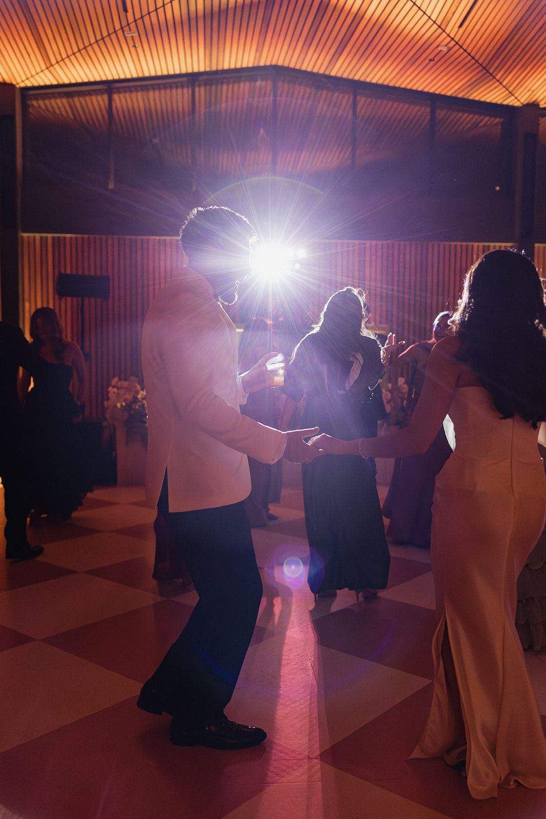 High-energy wedding dance floor at the San Antonio Botanical Garden reception