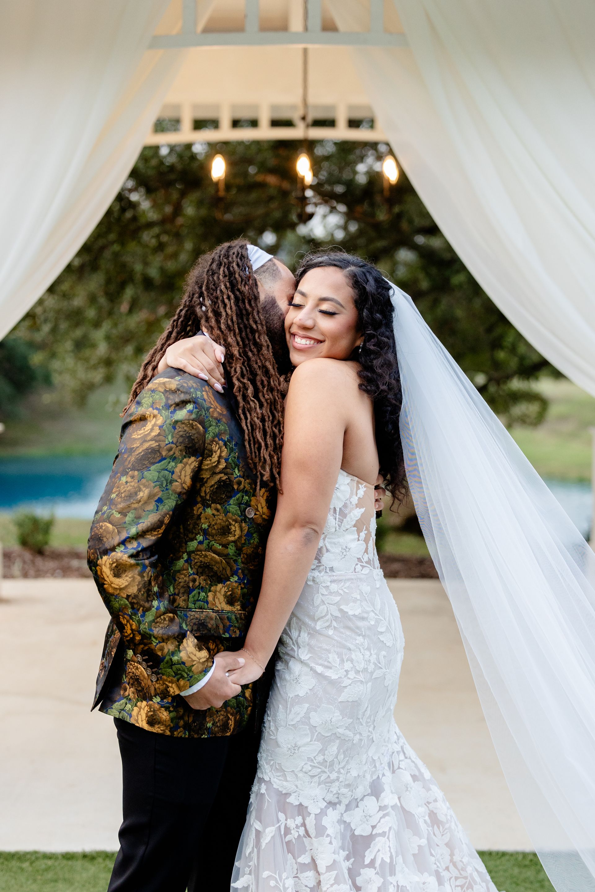 Kendall Point Wedding Ceremony outdoor bride and groom embrace