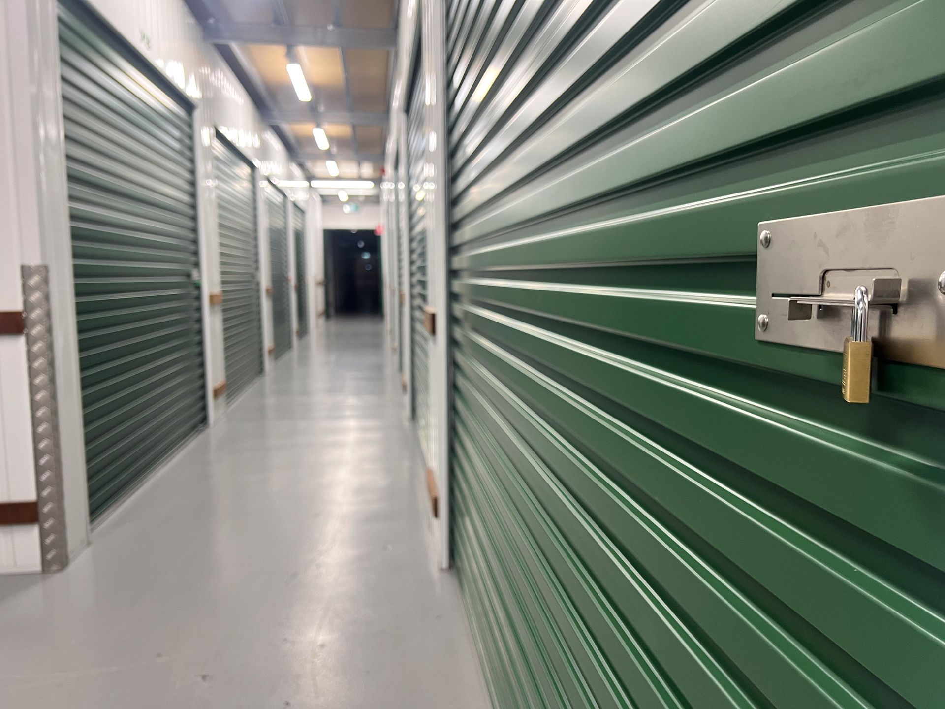 Empty corridor with self-storage rooms - Climate Controlled Self-Storage Facility Empty corridor with self-storage rooms - Climate Controlled Self-Storage Facility