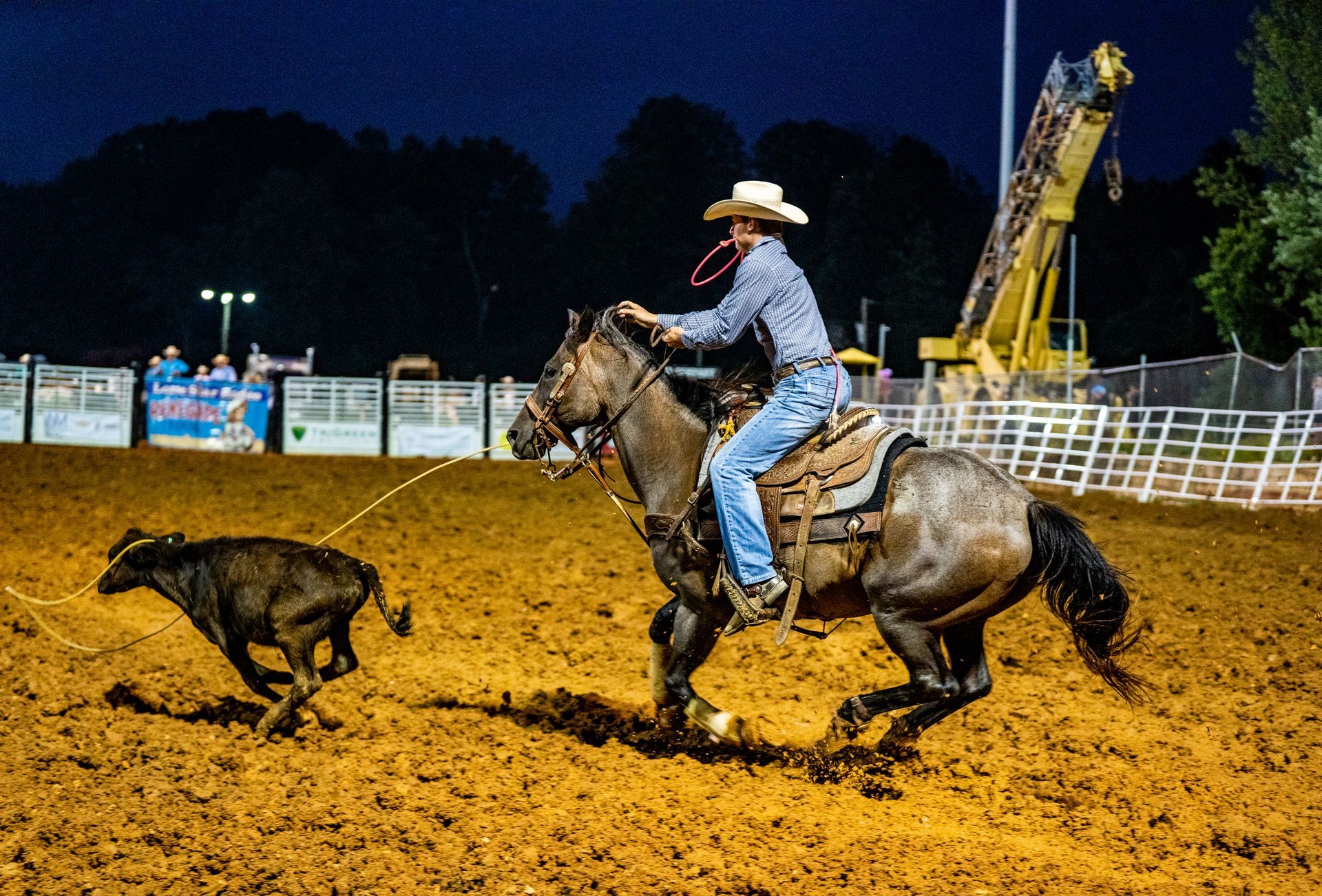 A man is riding a horse while a dog is chasing him