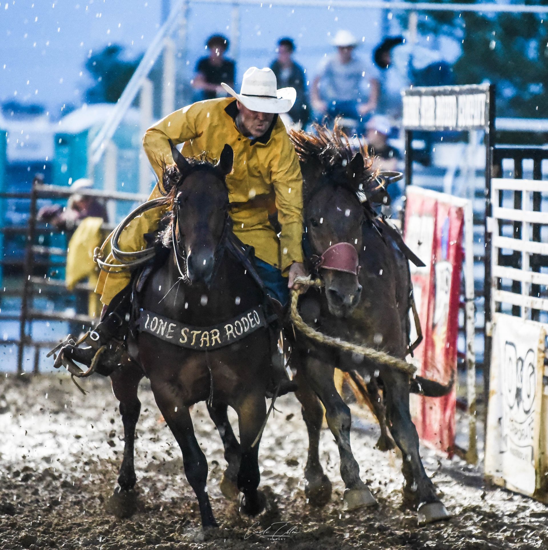 A man riding a horse that says lone star rodeo