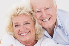 A smiling mature couple with healthy-looking teeth