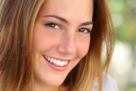 A smiling young lady with white teeth
