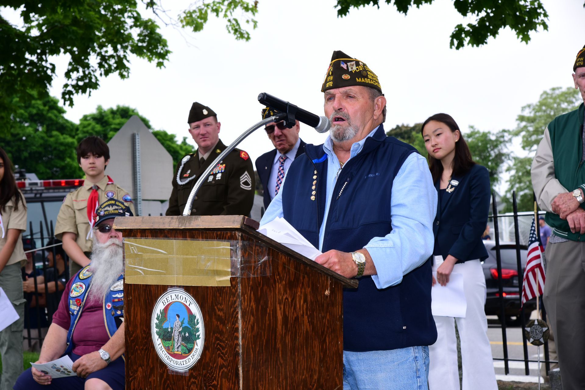 A man is standing at a podium giving a speech